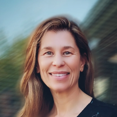 Chiropractor Tracy Homan Smiling In Front Of Window